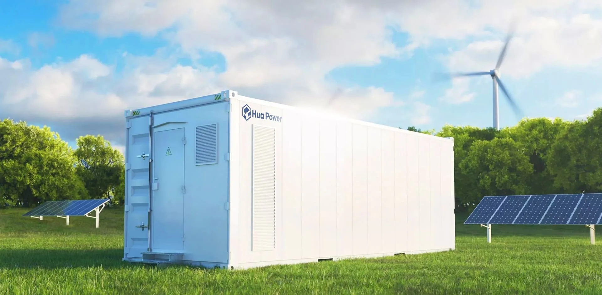 A white battery storage container on a green field with solar panels and a wind turbine behind it