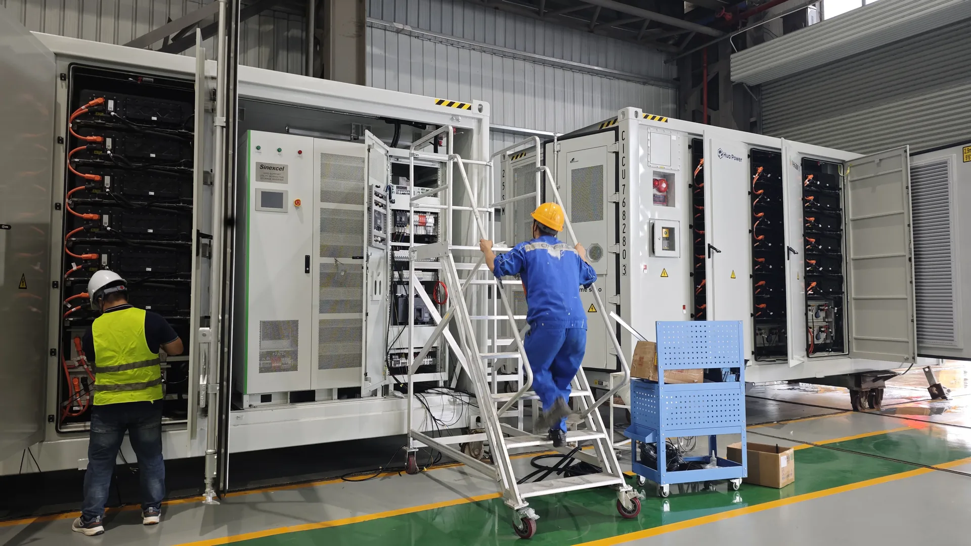 An assembly line inside a battery energy storage factory, where vertical integration removes intermediaries rather than manufacturing steps