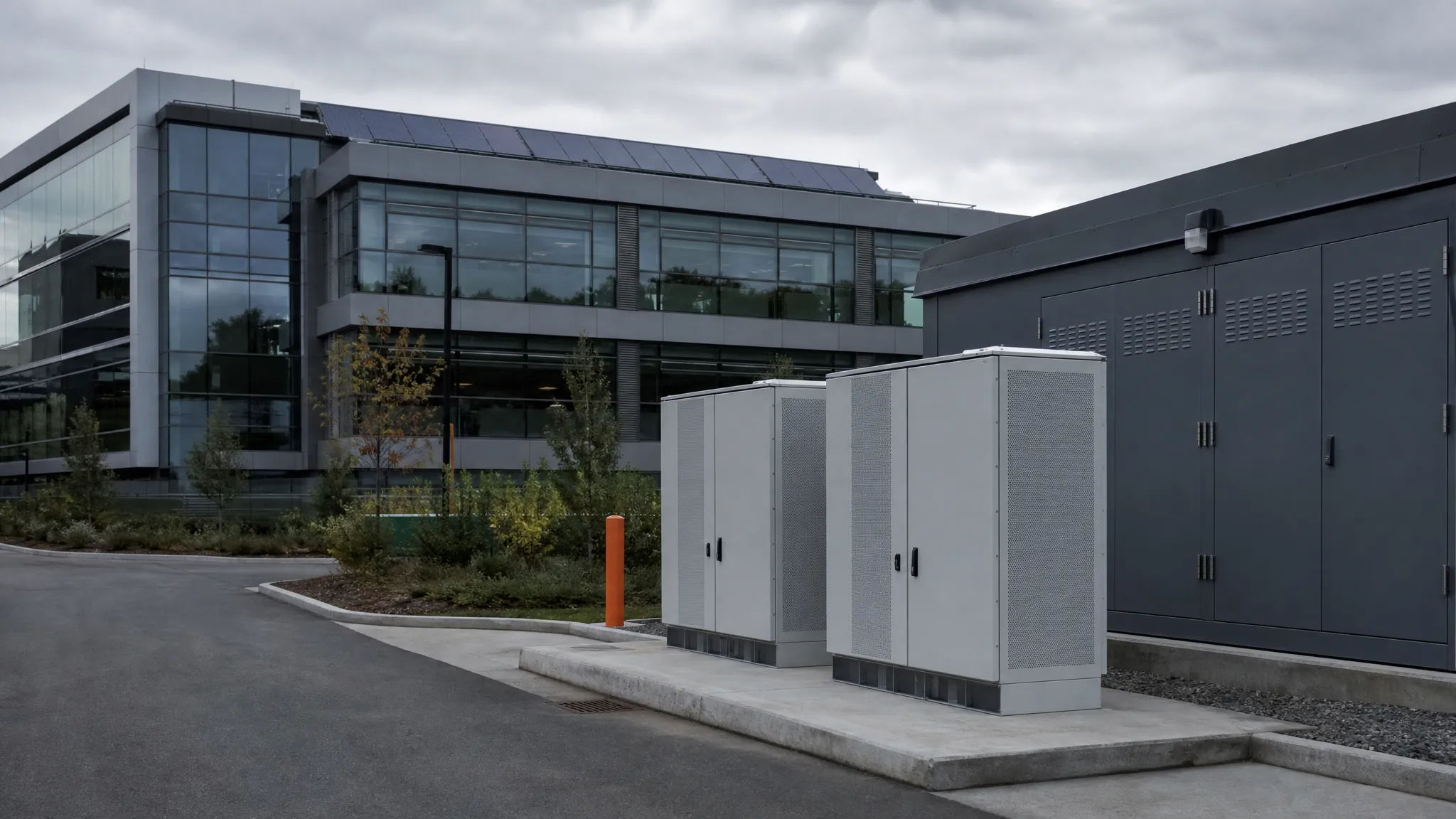 Rooftop solar array, outdoor battery cabinets and a low-voltage switchroom serving a commercial campus